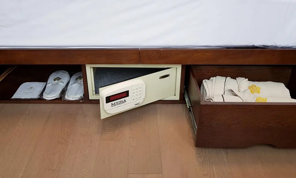 In-room safe and robes in the under-bed storage